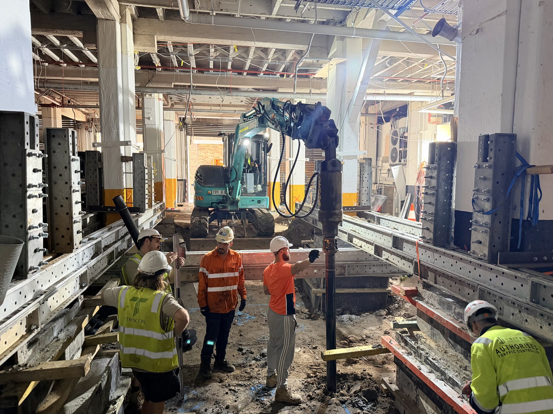 Screw pile installation operating within a constrained urban site